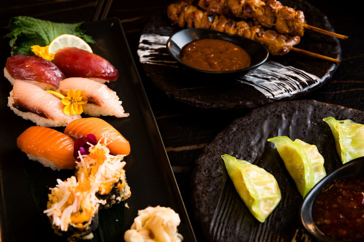 Teatro at Park Rotana Abu Dhabi business lunch menu consist of assorted plate of sushi, chicken or beef satay with peanut sauce and dumplings