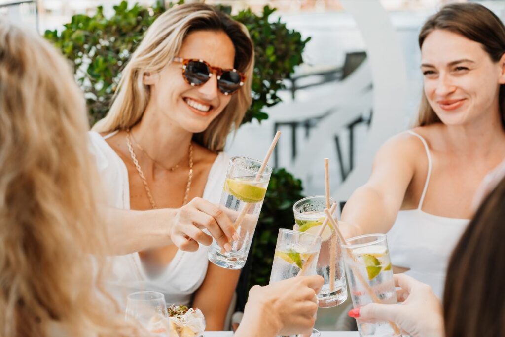 Ladies enjoying drinks at The Saturday Brunch Club at Conrad Abu Dhabi Etihad Towers