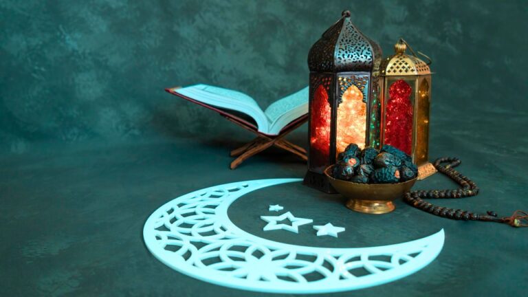 ramadan in abu dhabi featuring lantern, Quran, crescent moon and dates