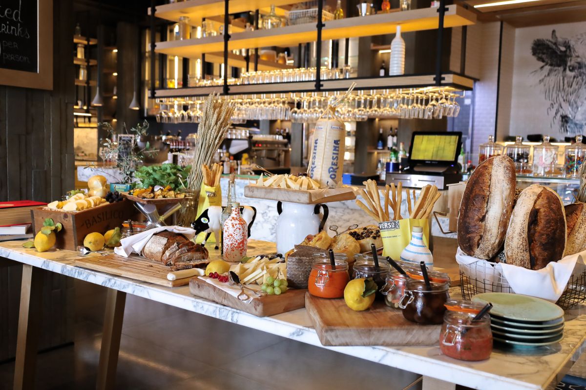 A display of Italian delicacies like sourdough bread, provolone cheese, olive oil, lemons at Grand Hyatt Abu Dhabi summer offers