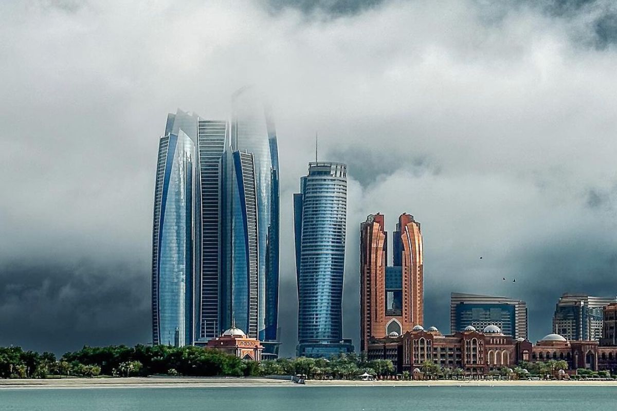 Abu Dhabi skyline featuring Etihad Tower on a cloudy day