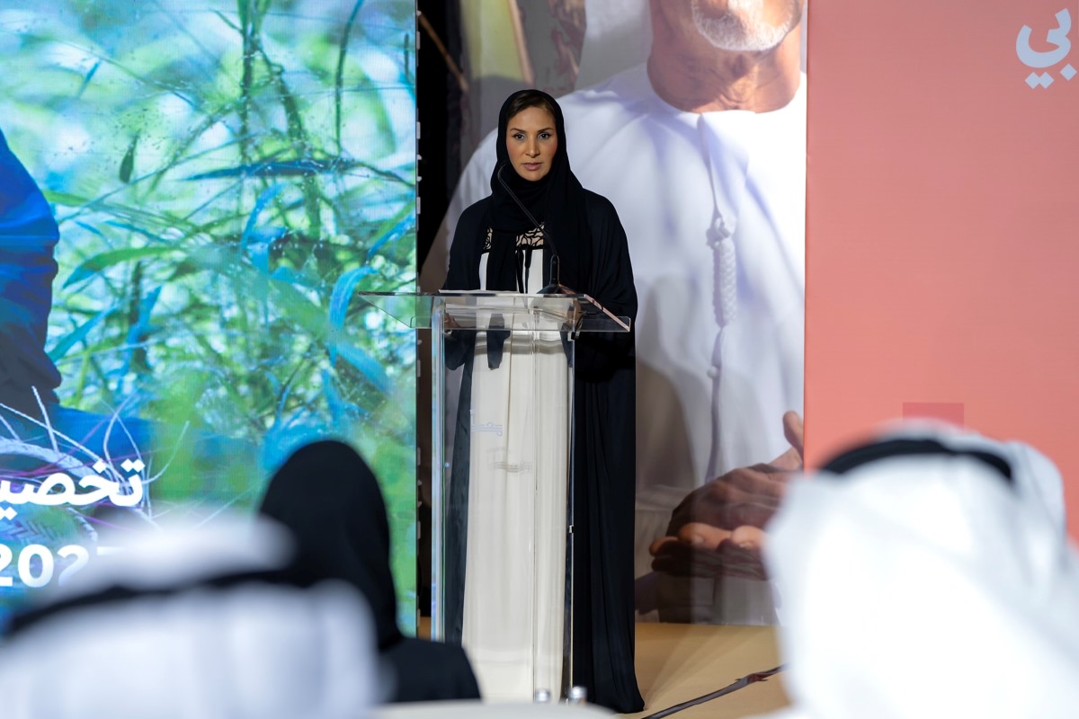 HE Salama Al Ameemi Director General of the Authority of Social Contribution Ma'an Abu Dhabi giving a speech at a podium