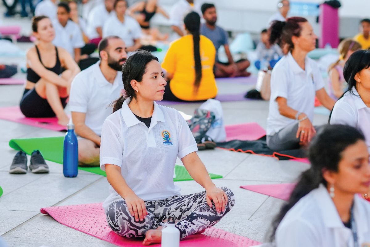 People posing for yoga for International Yoga day at Louvre Abu Dhabi