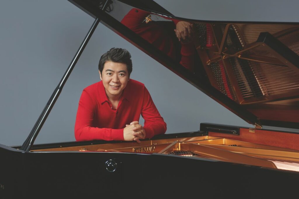 Lang Lang posing under a Steinway grand piano to relieve Disney classic songs at Etihad Arena this winter