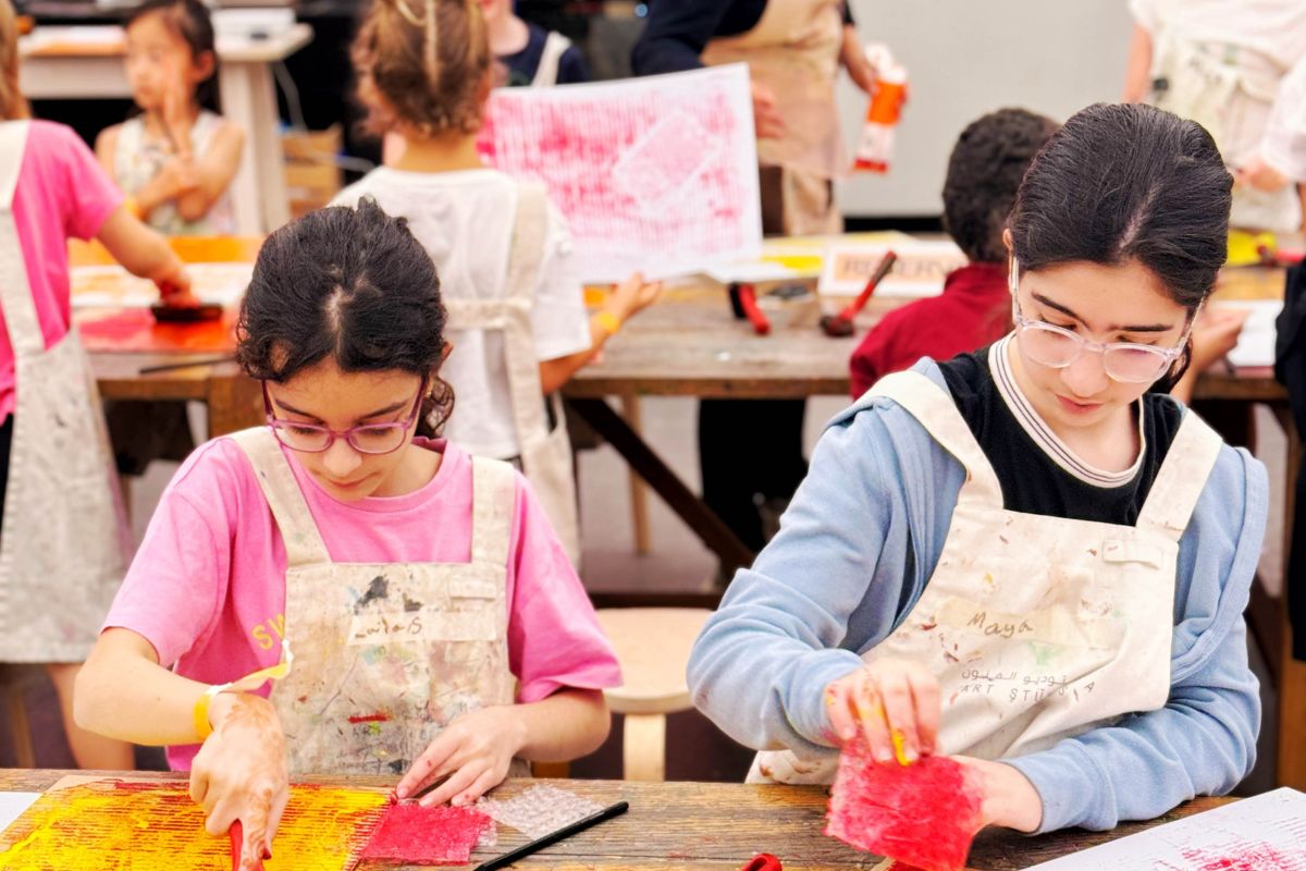 2 girls painting and making art for Summer Art Camp at Manarat Al Saadiyat and Berklee Abu Dhabi