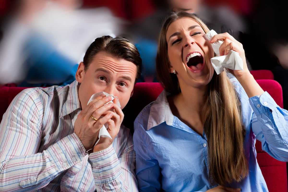 A couple watching a comedy show laughing