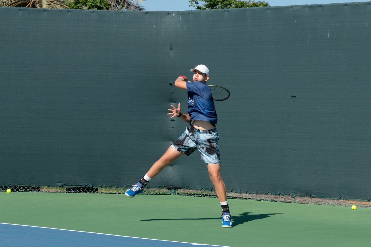 Tudor Zecheru, a rising tennis star in Abu Dhabi, receiving and playing tennis