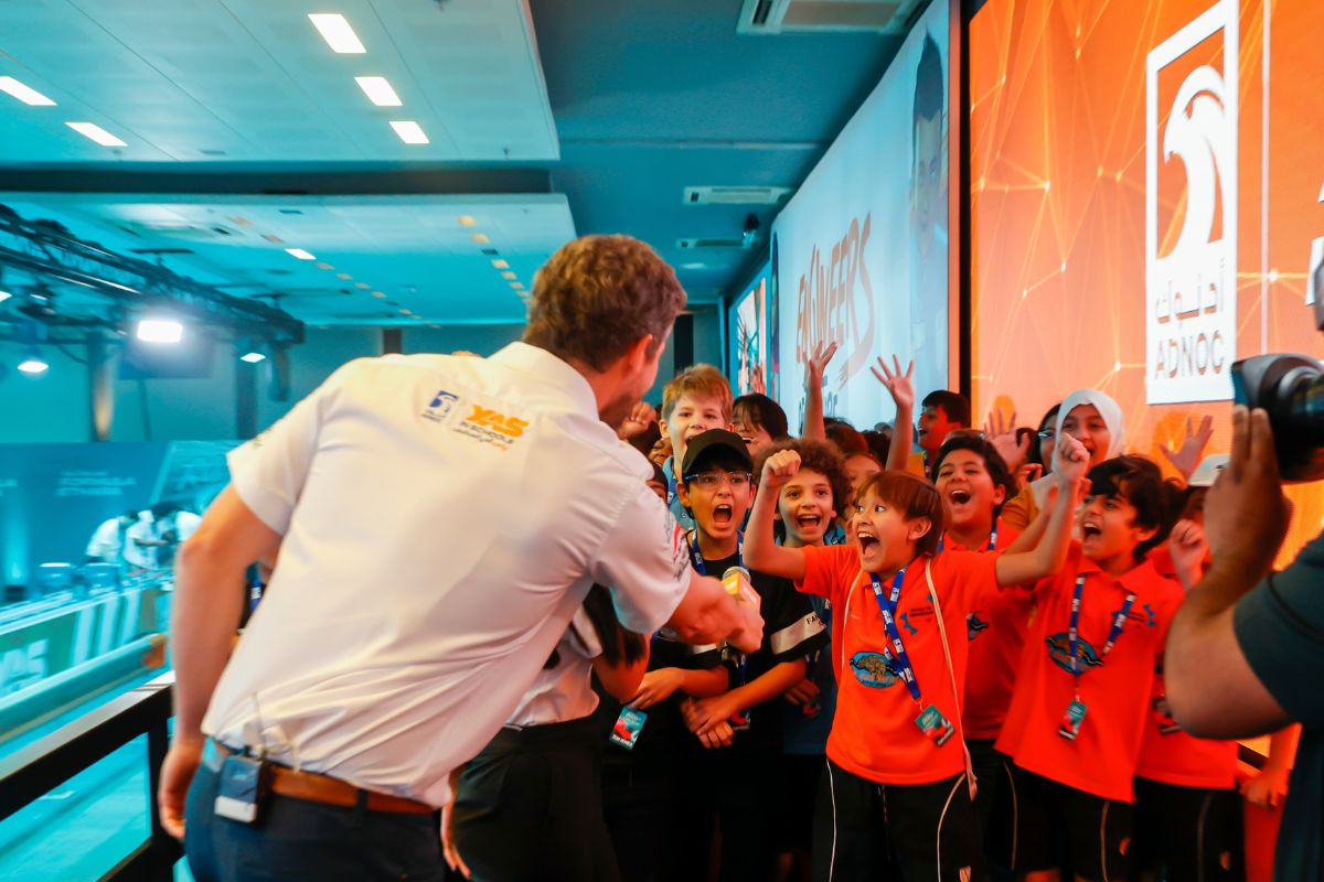 Kids cheering on for Yas Marina Circuit School Competition