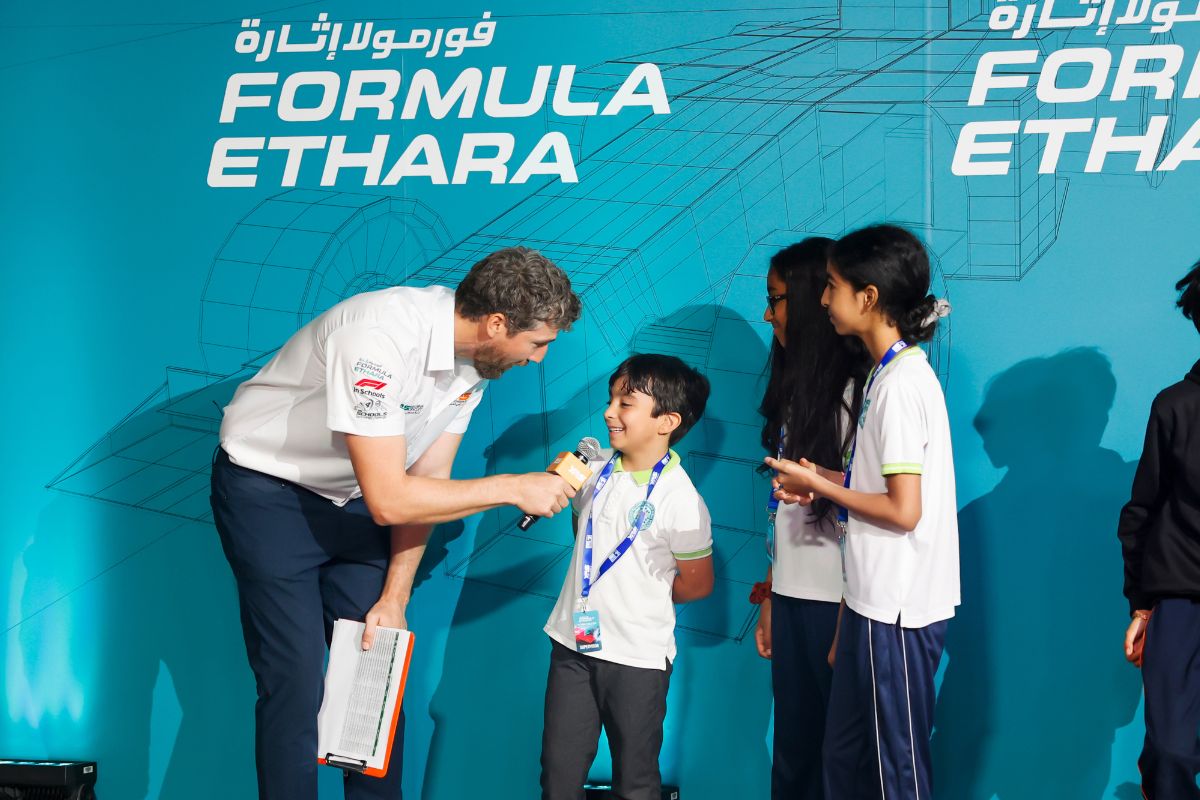 A kid being interviewed at Formula Ethara for Yas Marina Circuit School Competition