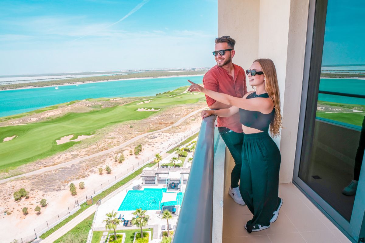 A couple sightseeing at Yas Plaza Hotels for the best things to do this Eid Al Adha