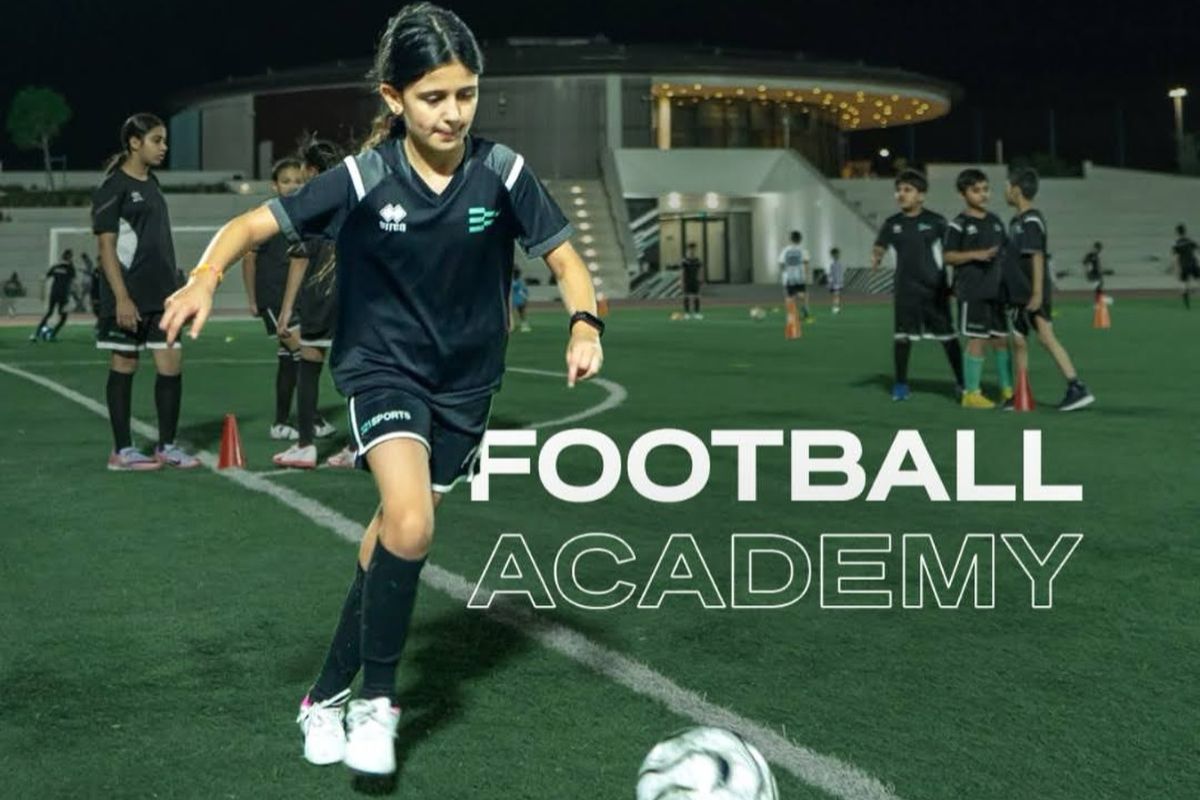 321 Sports summer camp, a girl kicking a football at a football academy