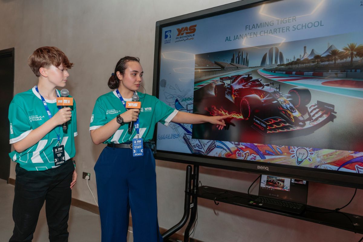 Two students doing a presentation about a car for ADNOC Yas in Schools National finals this 2024