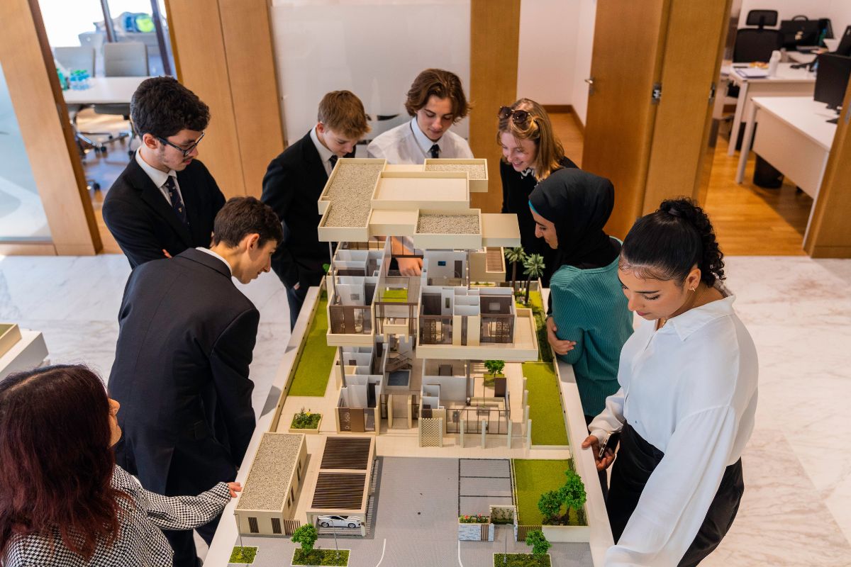 Cranleigh Abu Dhabi Senior students observing a model town house