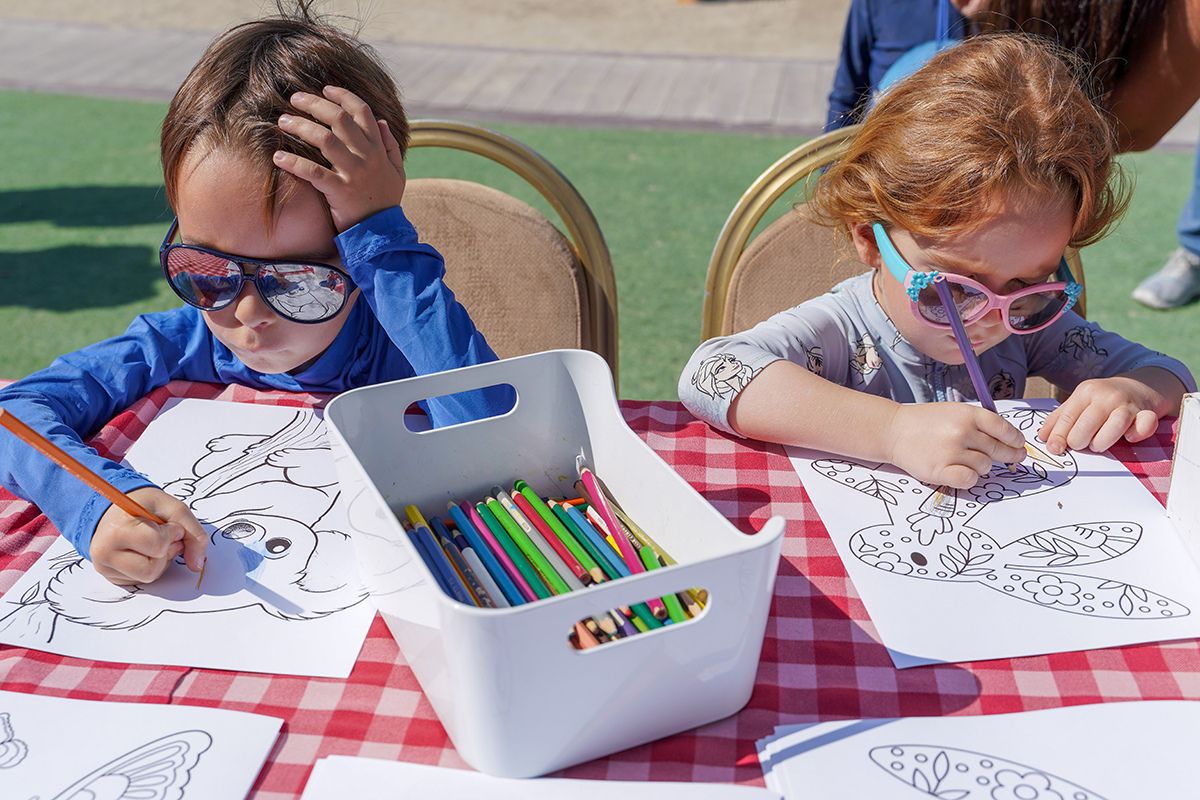 Kids coloring at The Club Abu Dhabi summer camp