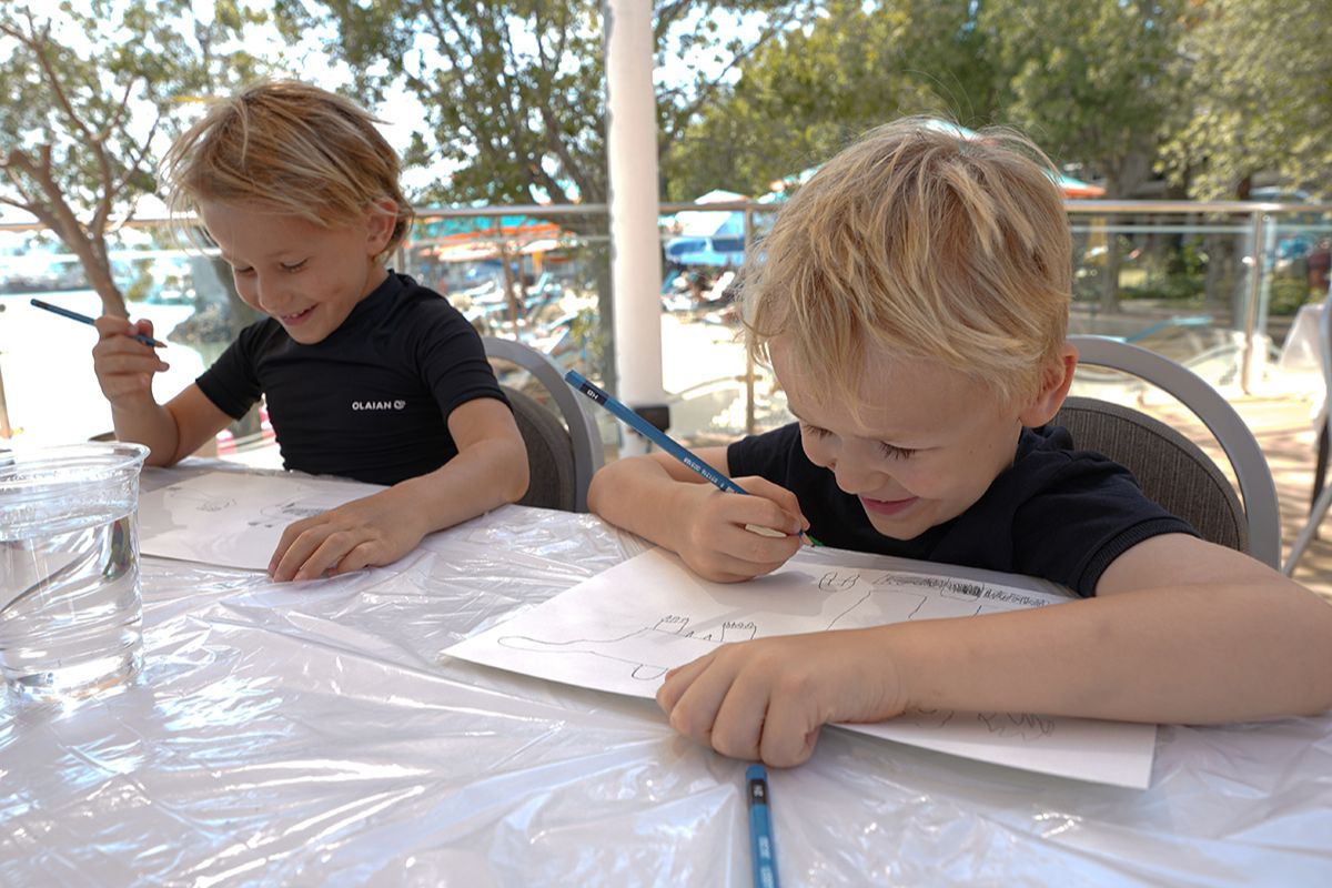 Kids coloring at The Club Abu Dhabi summer camp