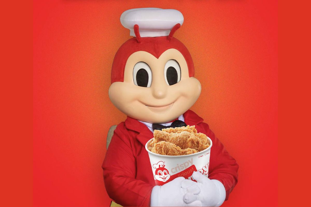 Jollibee mascot holding a bucket of the famous ChickenJoy