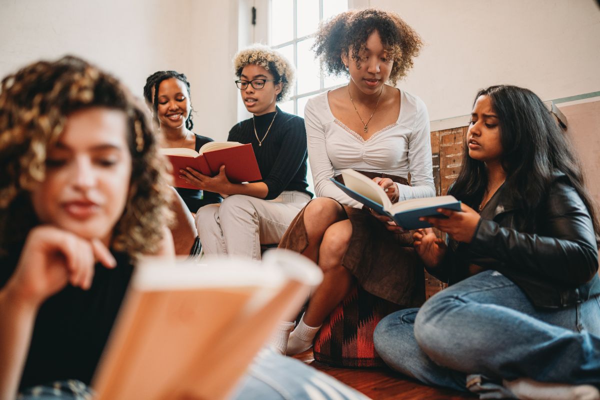 Ladies reading books for International Literacy Day