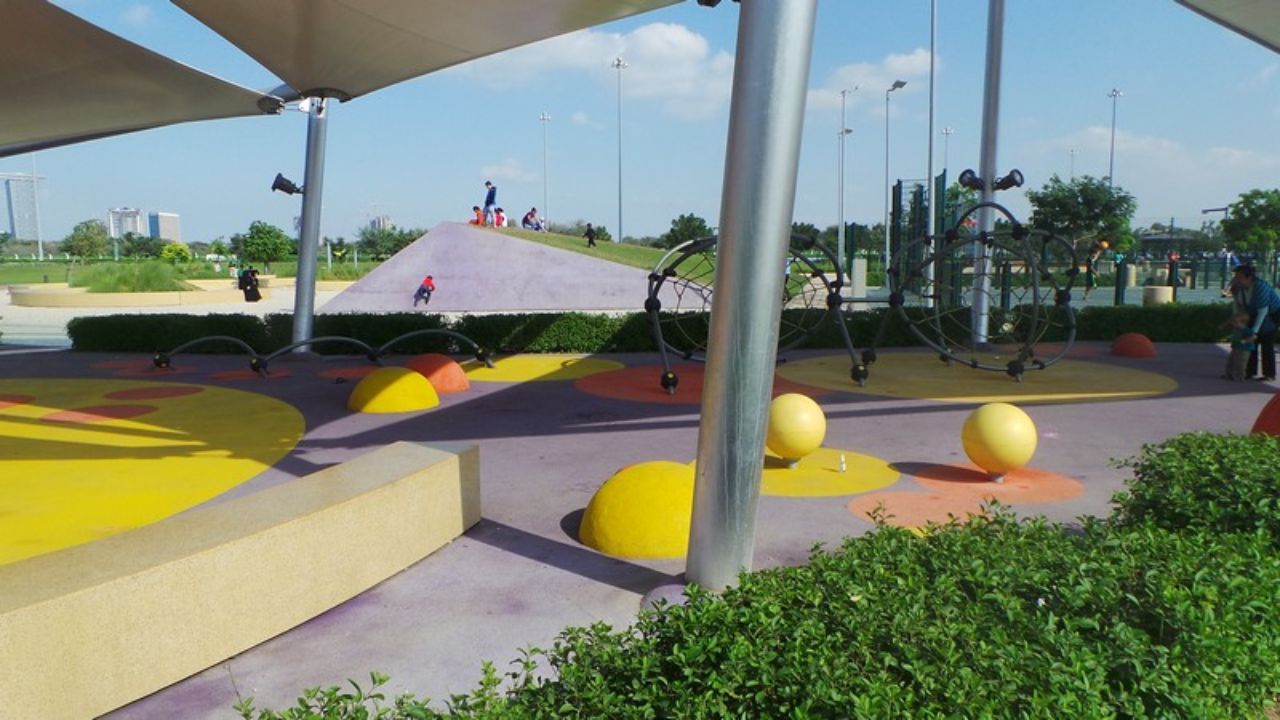 A playground with colorful balls and climbing equipment at delma park abu dhabi