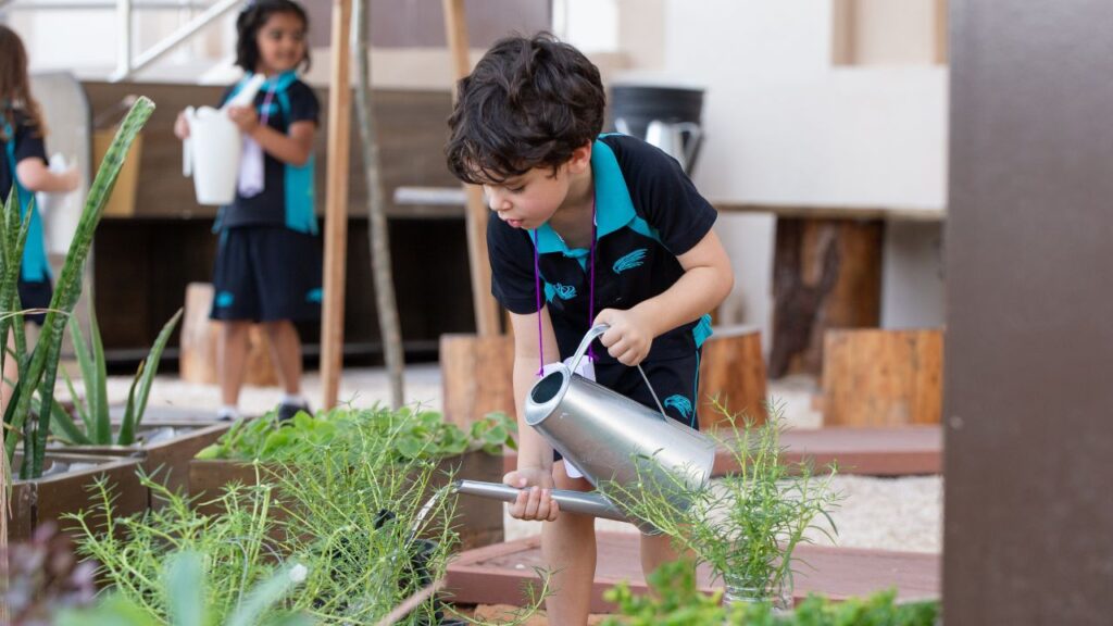 the british international school abu dhabi gardening student