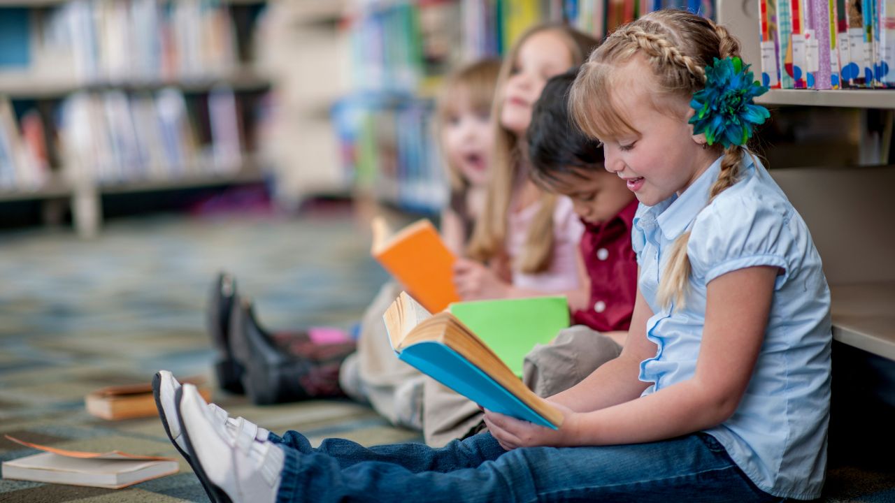 children reading books in library
