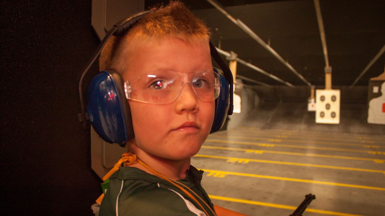kid at shooting range
