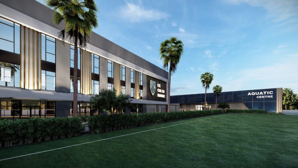 Modern aquatic centre with palm trees and green lawn in Abu Dhabi.