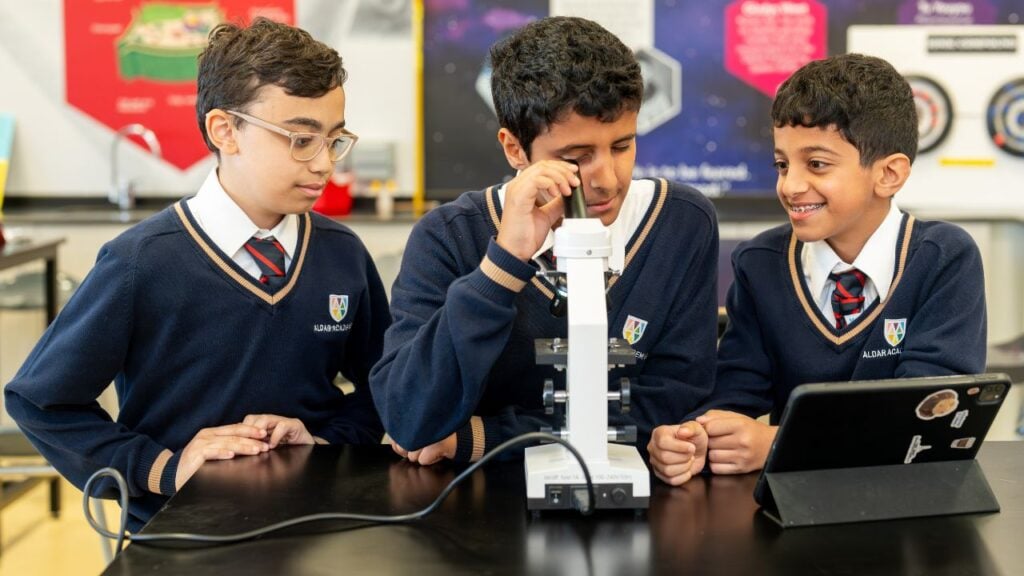 three male students looking
