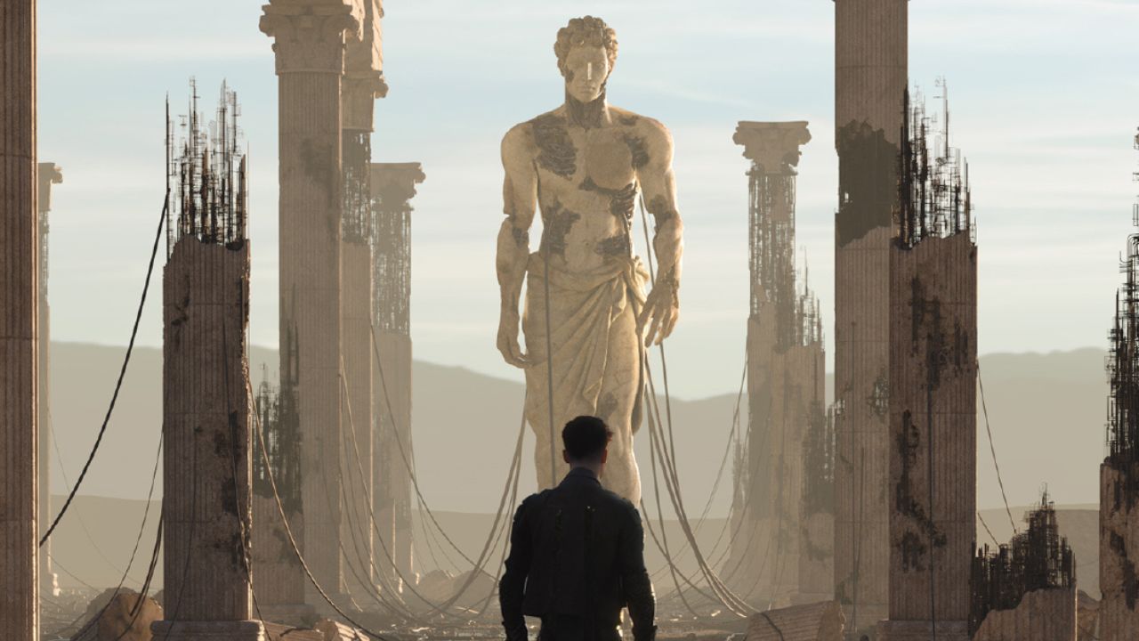 Ruined statue with a guy standing in front