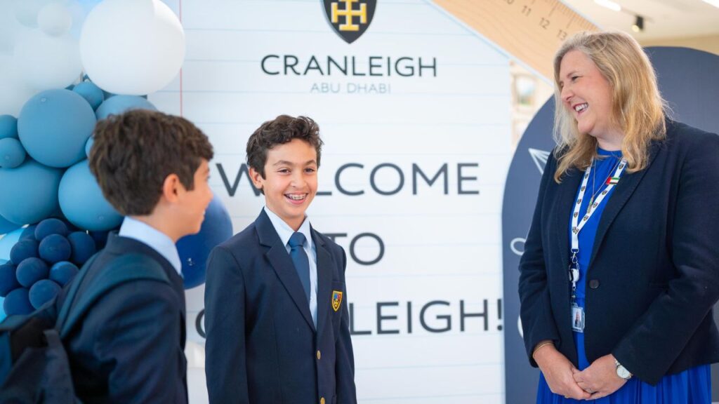 A teacher and students talking
