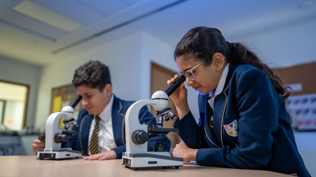 2 students on the microscope