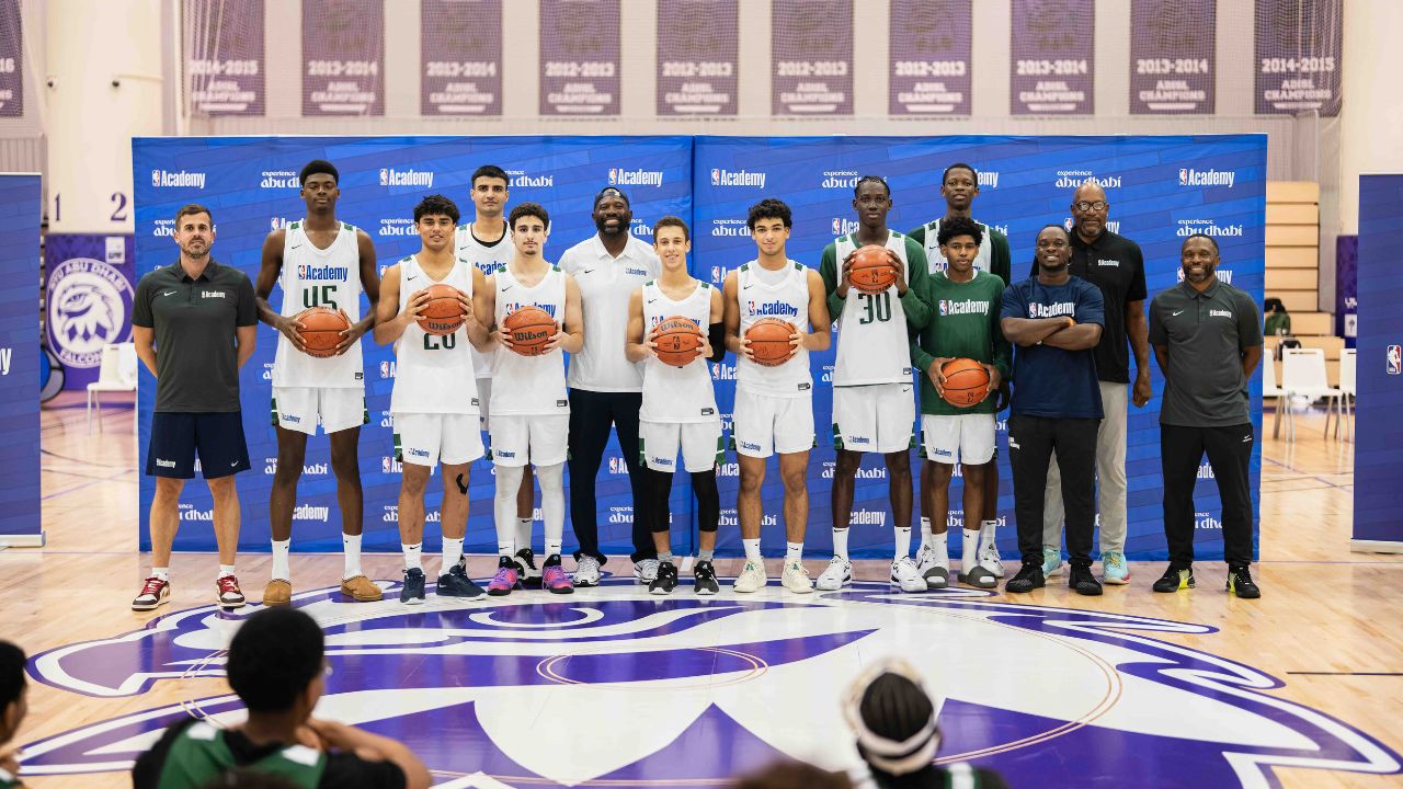 basketball players holding ball
