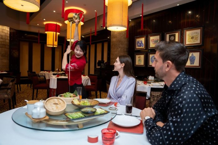 Traditional tea pouring for guests at Shang Palace, Shangri-La Qaryat Al Beri Abu Dhabi