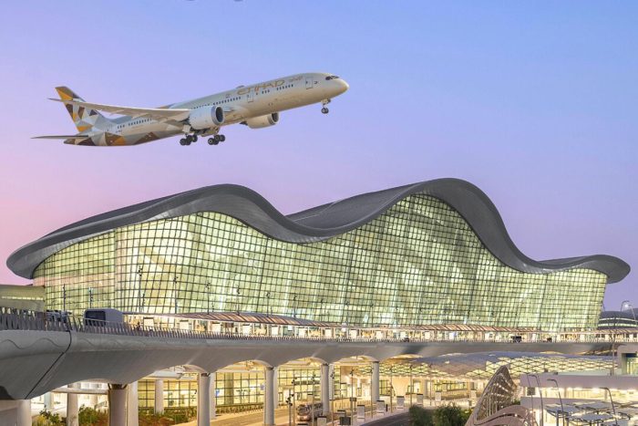 Etihad airplane flying over Zayed International Airport