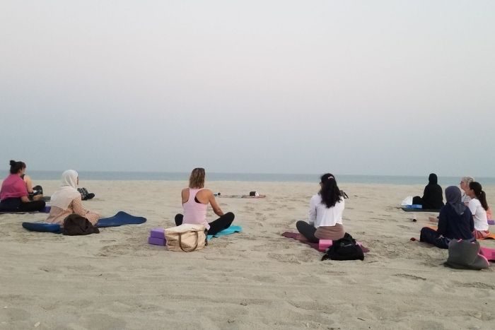 Yoga at sand near beach with innerseed