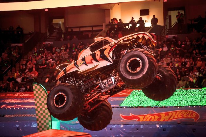 A Hot Wheel Monster Truck live glow crushing small cars underneath, going live this November in Etihad Arena