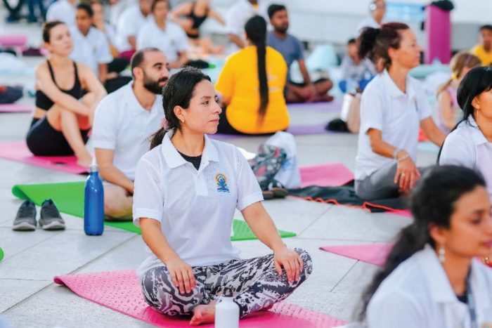 People posing for yoga for International Yoga day at Louvre Abu Dhabi