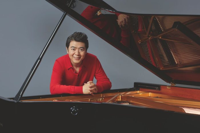 Lang Lang posing under a Steinway grand piano to relieve Disney classic songs at Etihad Arena this winter